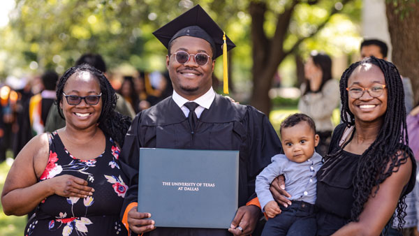 A family poses with a graduate 